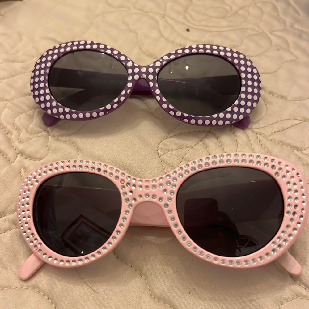 Two little girls sunglasses used in good shape pink and purple